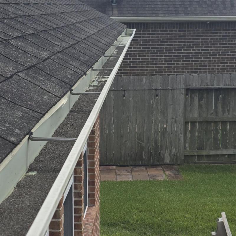 Roof gutters with debris and granule loss inspection