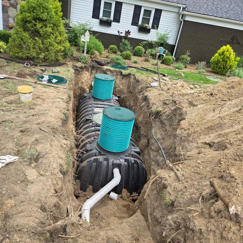 Septic tank and field installation in residential yard