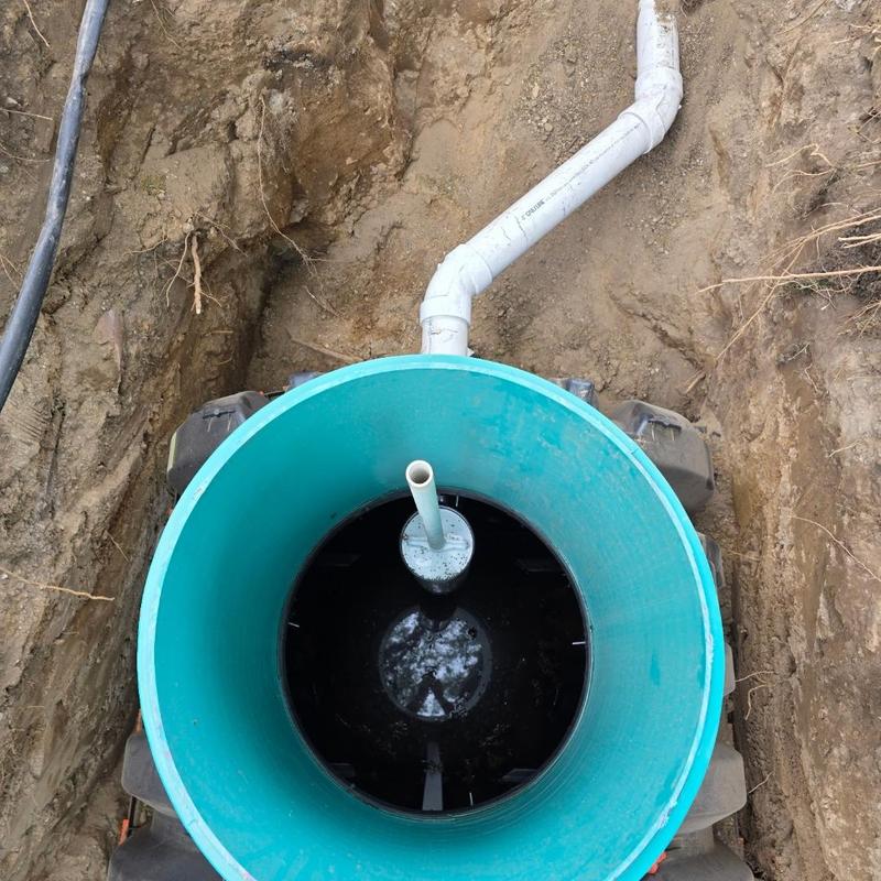 Septic tank installation with drainage pipe connection