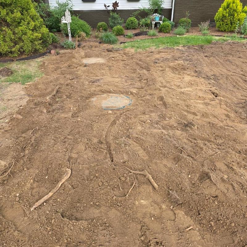 Septic tank covers in freshly dug soil yard