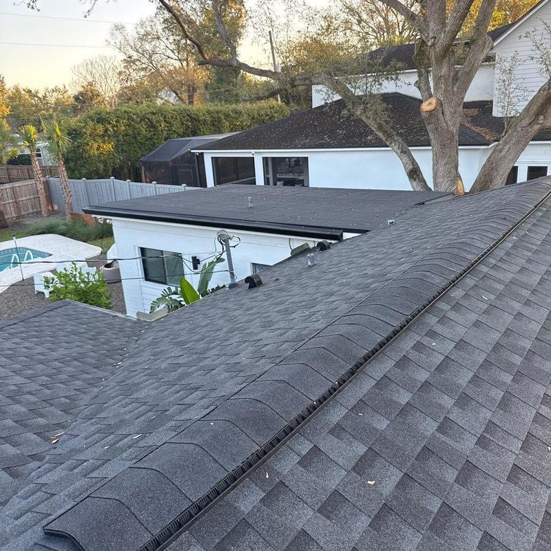 Architectural shingle roof with modified bitumen flat section Architectural shingle roof with modified bitumen flat section