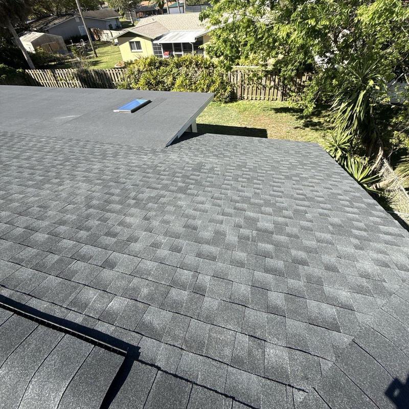 Architectural shingle roof with flat modified bitumen section Architectural shingle roof with flat modified bitumen section