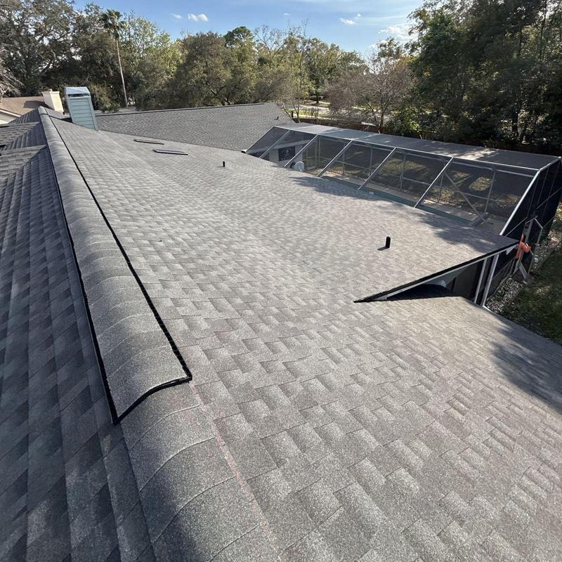 Architectural shingle roof with new ridge cap and skylights Architectural shingle roof with new ridge cap and skylights