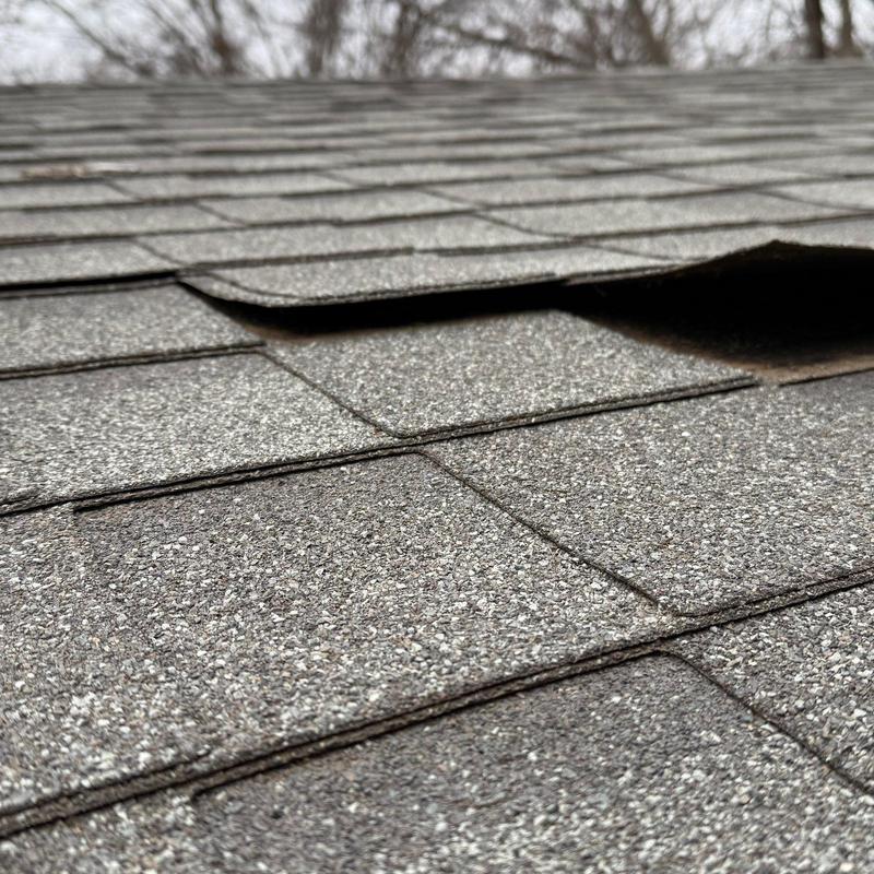 Roof shingles lifting on residential roof in Lincoln, NE