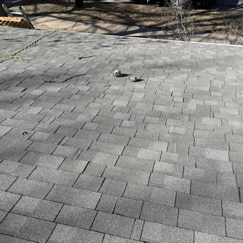 Asphalt shingle roof with vent covers in Lincoln, NE