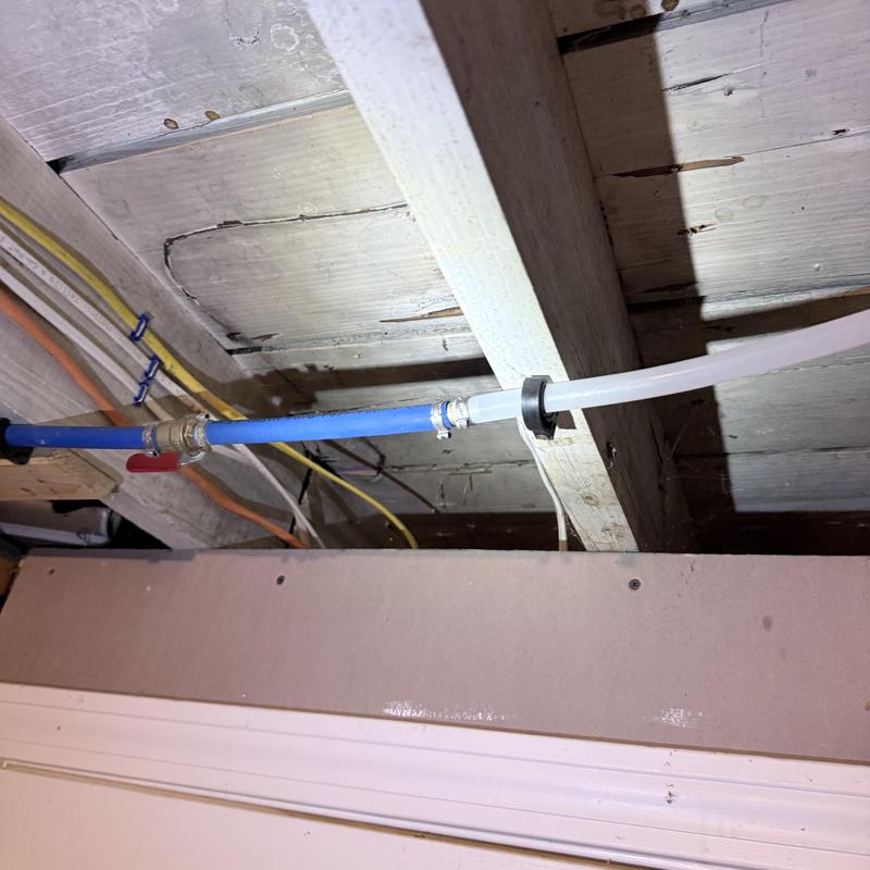 Silcock valve and attached piping under ceiling beams