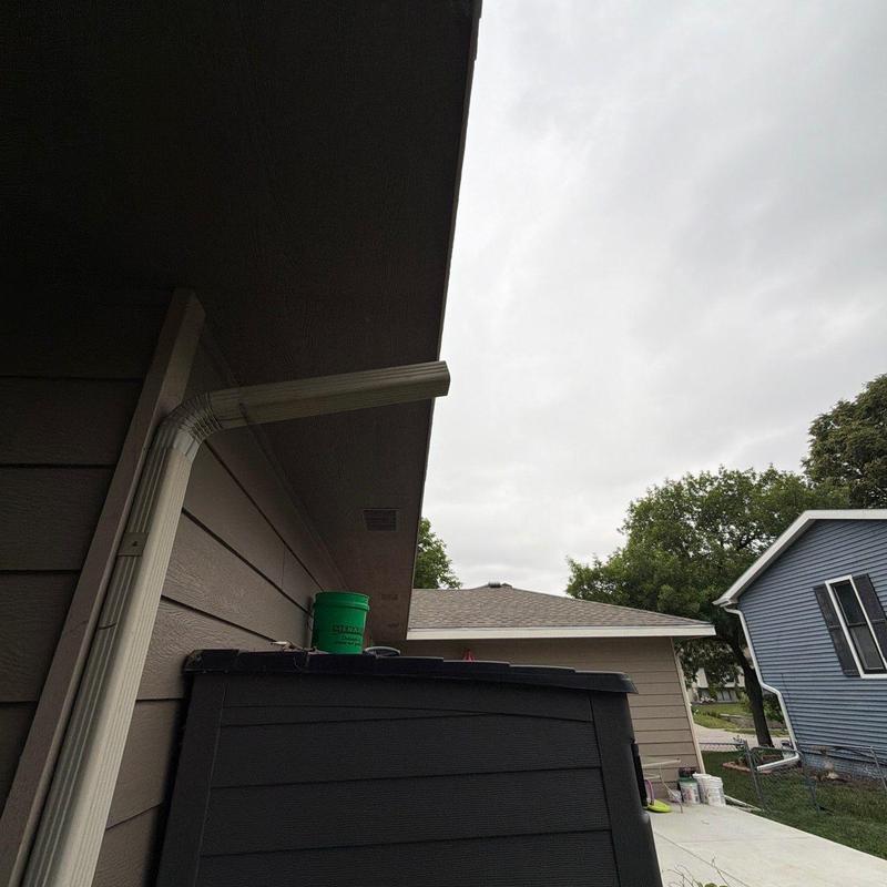 5 K Style aluminum gutter downspout on house exterior