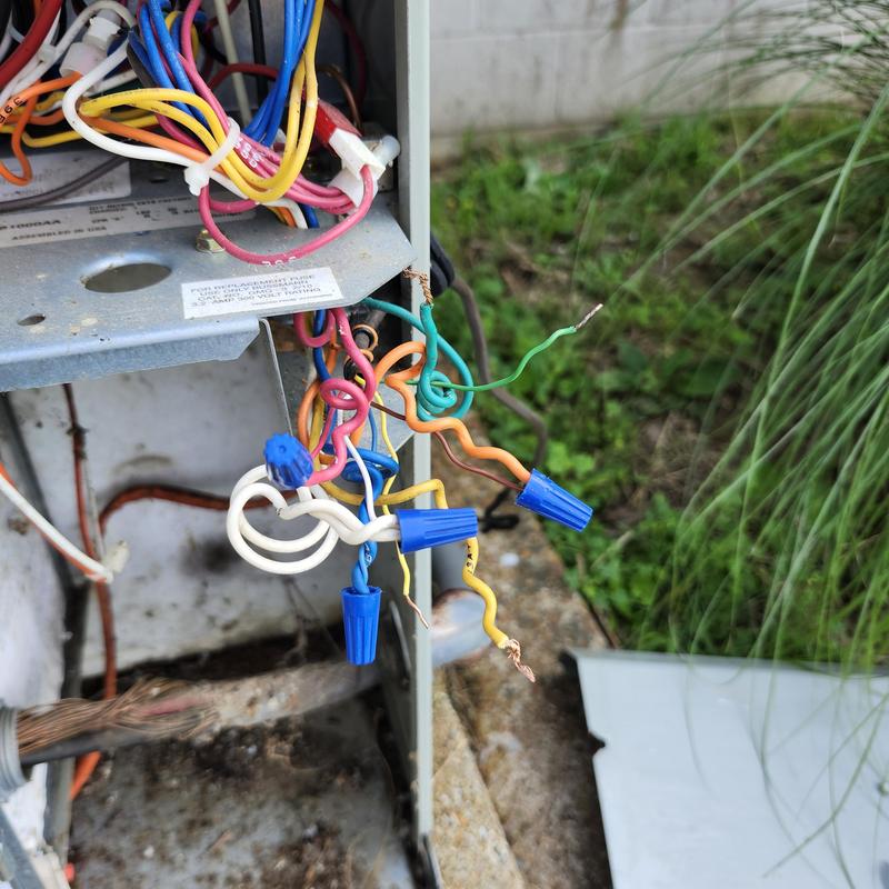 HVAC unit wiring with wire nuts and exposed copper ends HVAC unit wiring with wire nuts and exposed copper ends