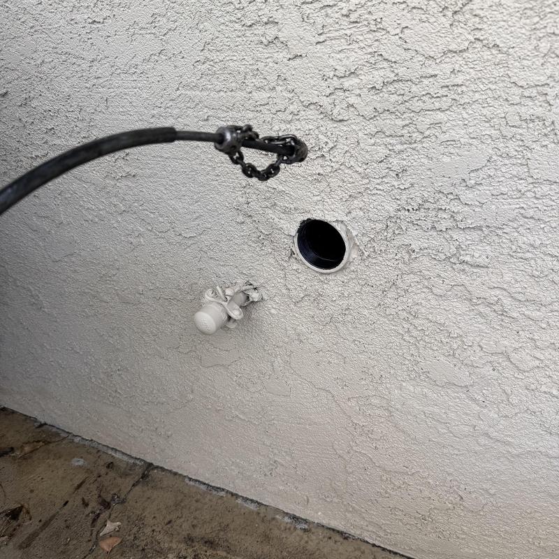 Kitchen sink cleanout with roto-rooter snake in wall Kitchen sink cleanout with roto-rooter snake in wall