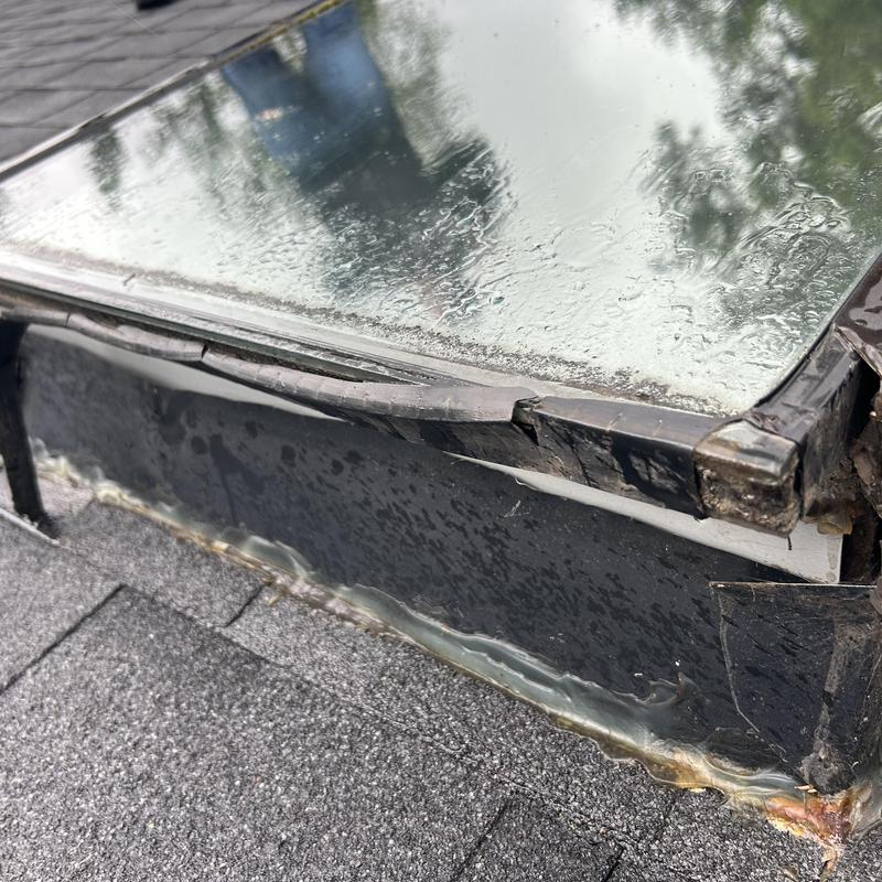 Skylight flashing and seal damage on roof leak repair