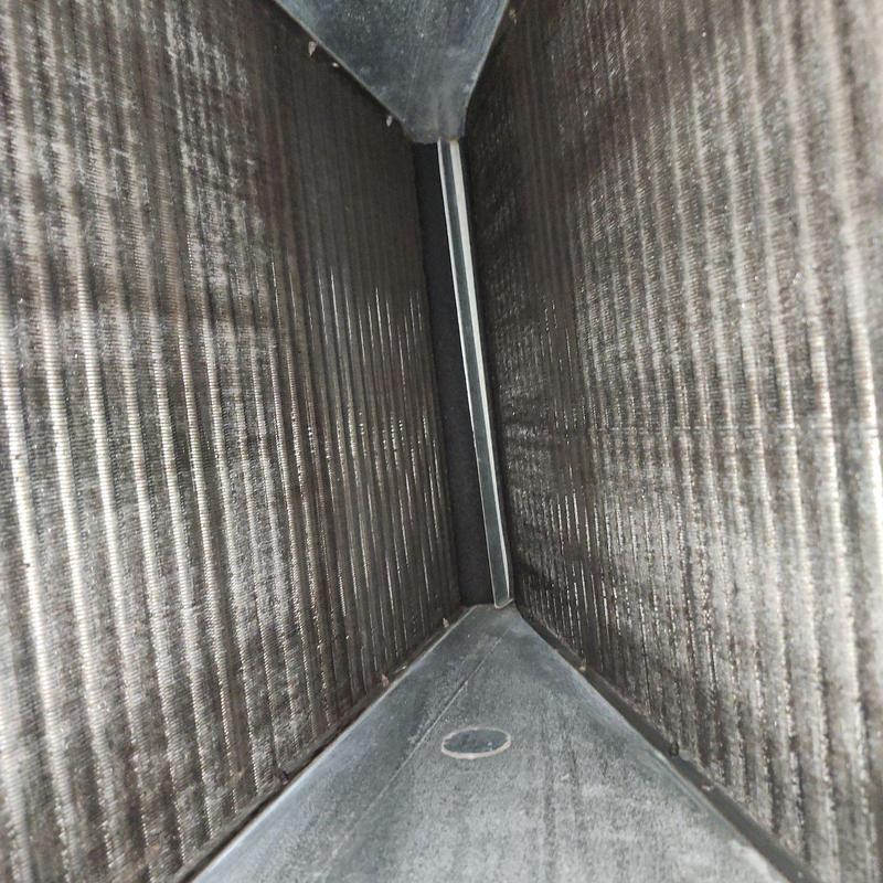 Air handler evaporator coil with dust buildup inside
