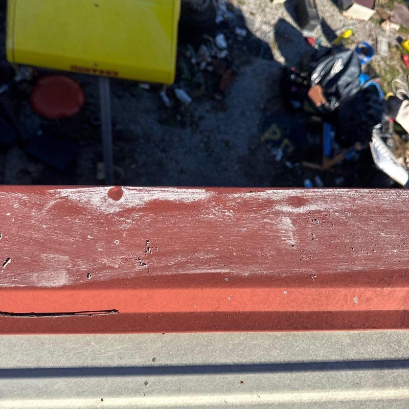 Roof flashing with hail damage and wear marks