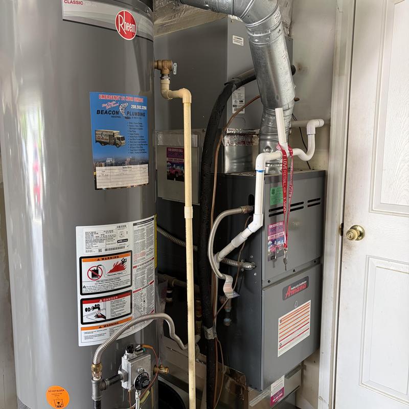 Water heater and furnace installation with piping and ductwork Water heater and furnace installation with piping and ductwork