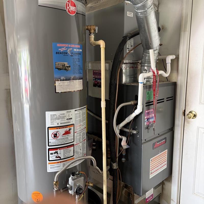 Water heater installation with furnace unit in utility room Water heater installation with furnace unit in utility room