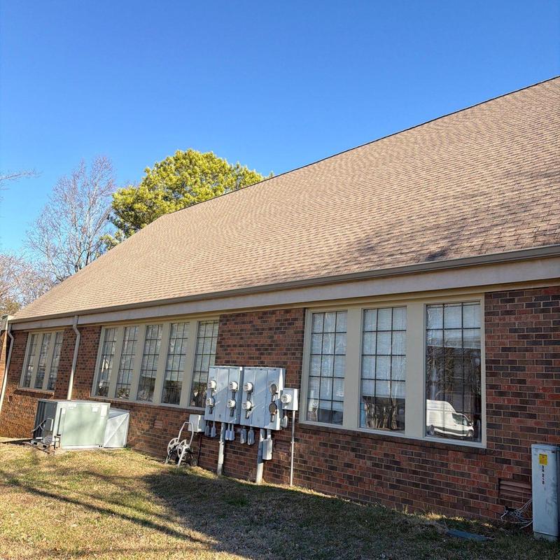 Roof shingles and ventilation system inspection on building