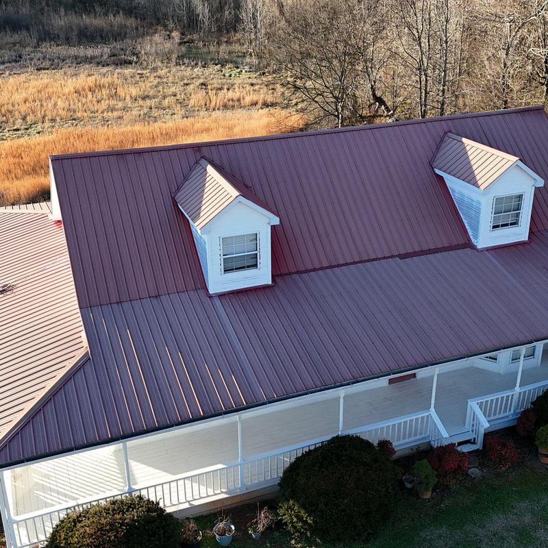Metal roof panels on residential house after inspection