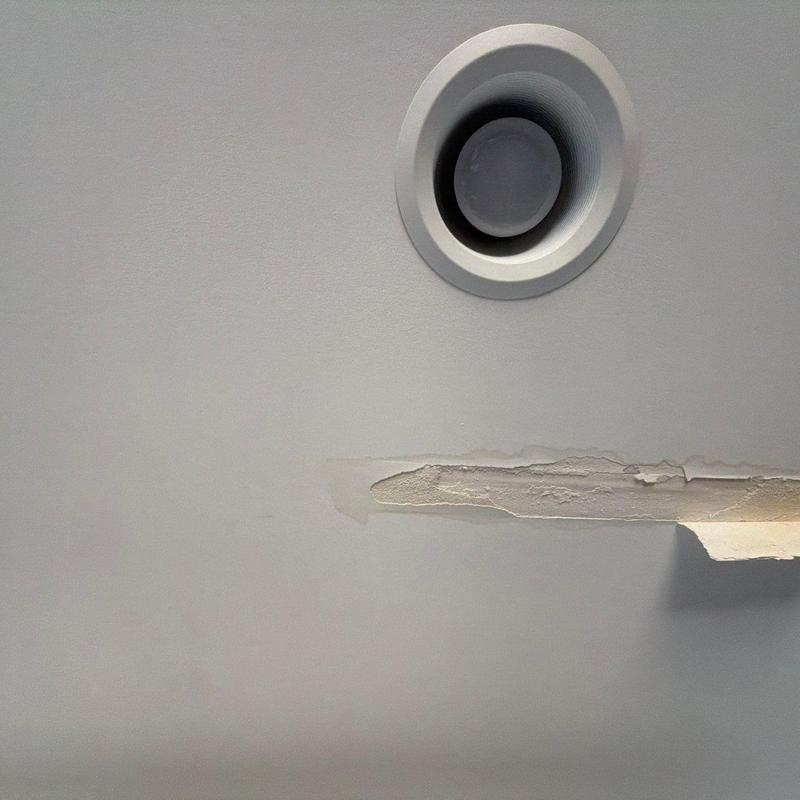 Ceiling drywall with water damage near vent