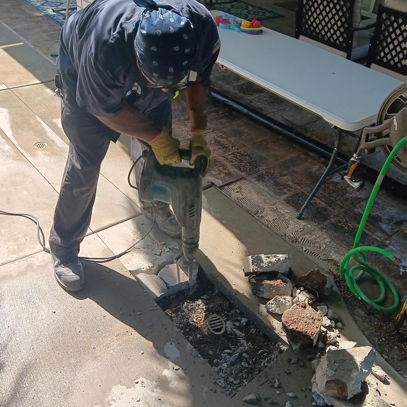 Area drain with concrete removal and debris cleanup