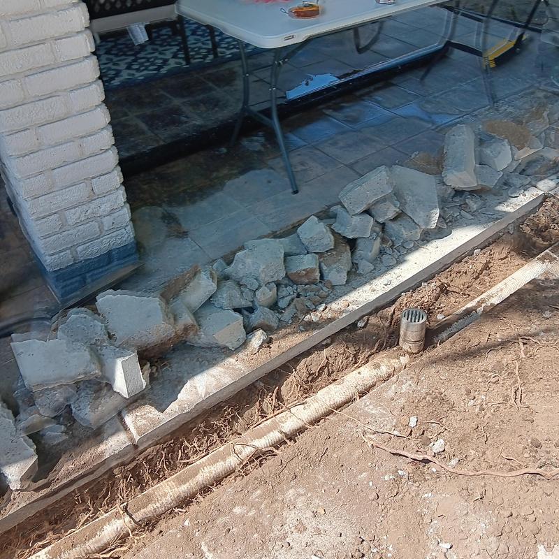 Area drain with ABS piping and broken concrete debris