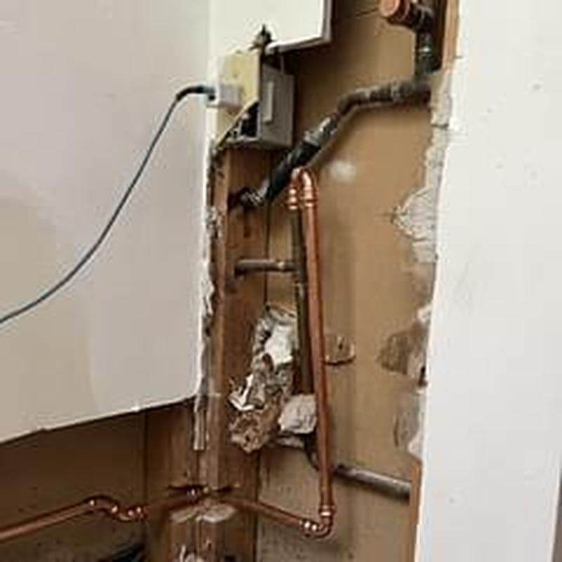 Copper hot water supply line installation in wall cavity