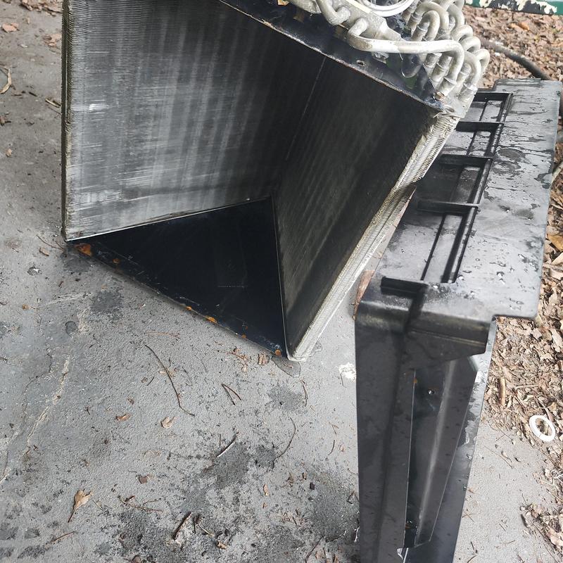 Evaporator coil removed and cleaned outdoors
