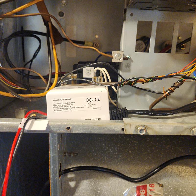 UV light ballast installed inside HVAC unit with wiring