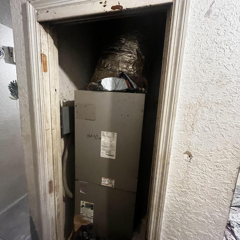 Indoor coil unit with severe debris buildup in closet