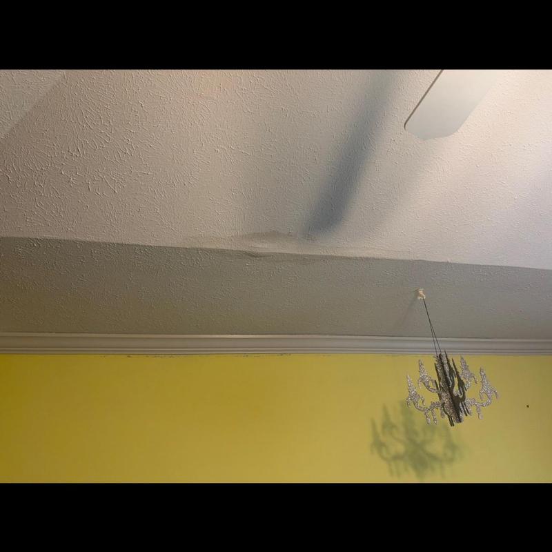Ceiling water damage under metal roof leak area