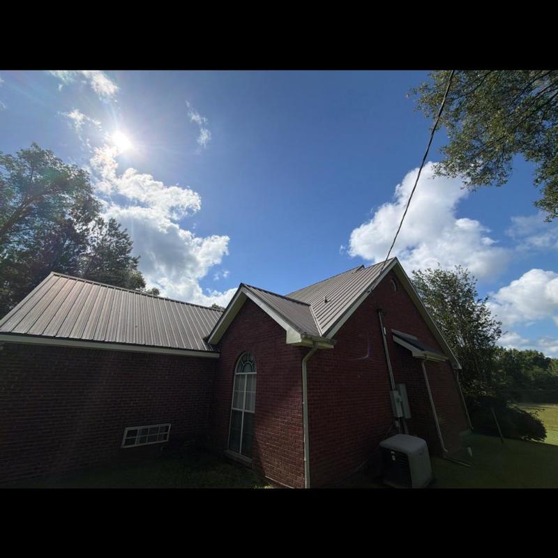 Metal roof with loose screws causing leaks