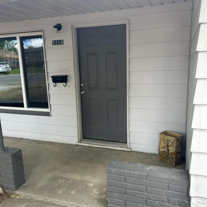Exterior front door and porch of residential home Exterior front door and porch of residential home