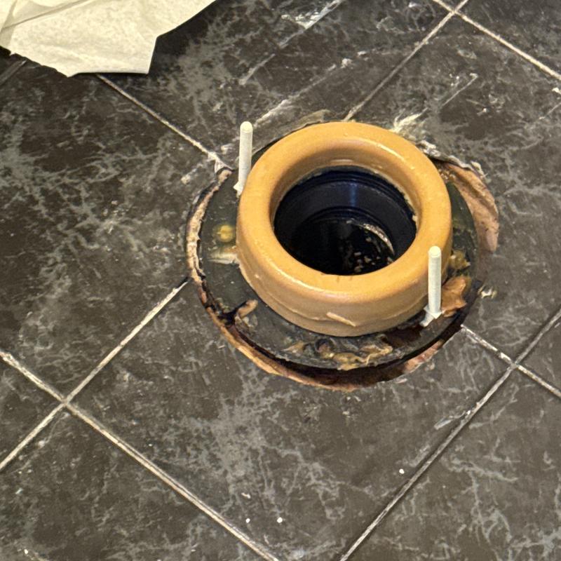 Toilet flange on tiled bathroom floor Toilet flange on tiled bathroom floor
