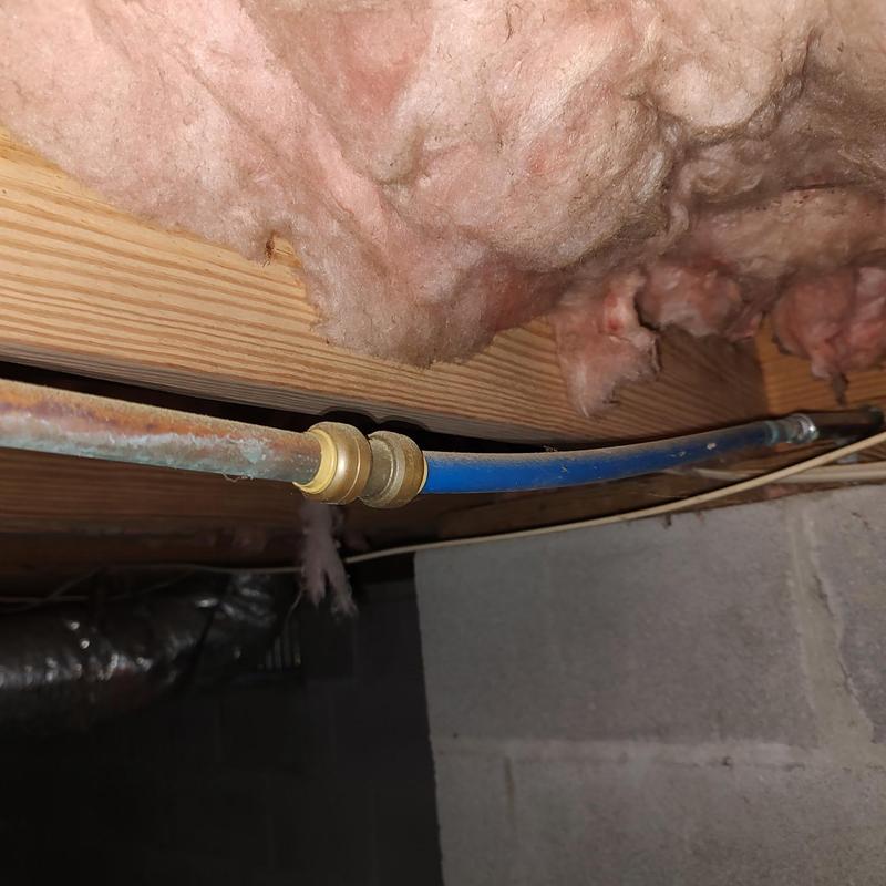 PEX and copper pipe connection with insulation above PEX and copper pipe connection with insulation above