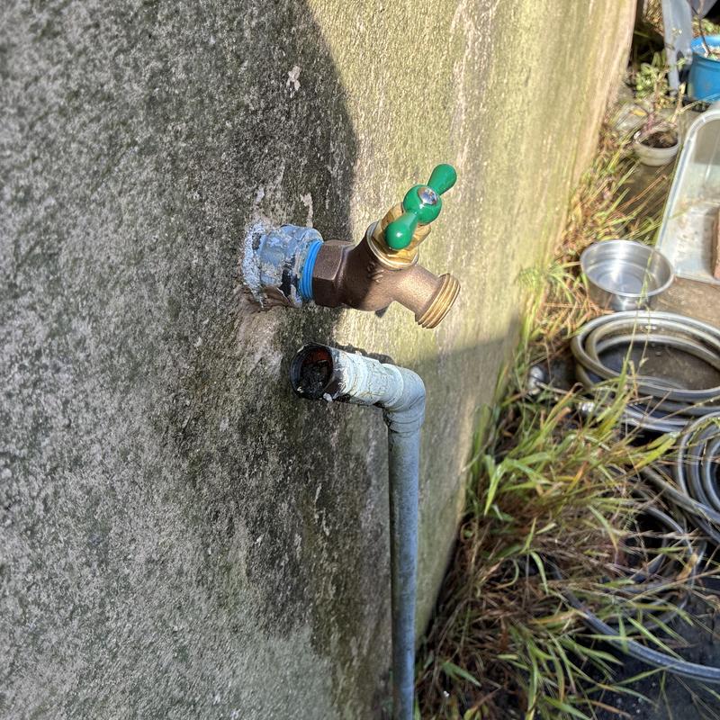 Outdoor hose bib replacement on concrete wall