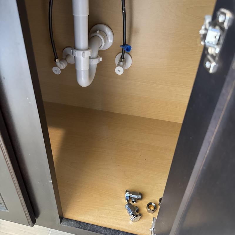 Compression shut off valves and plumbing pipes under sink Compression shut off valves and plumbing pipes under sink