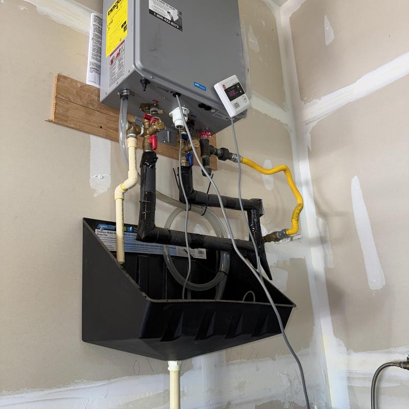 Rheem tankless water heater with maintenance tray Rheem tankless water heater with maintenance tray