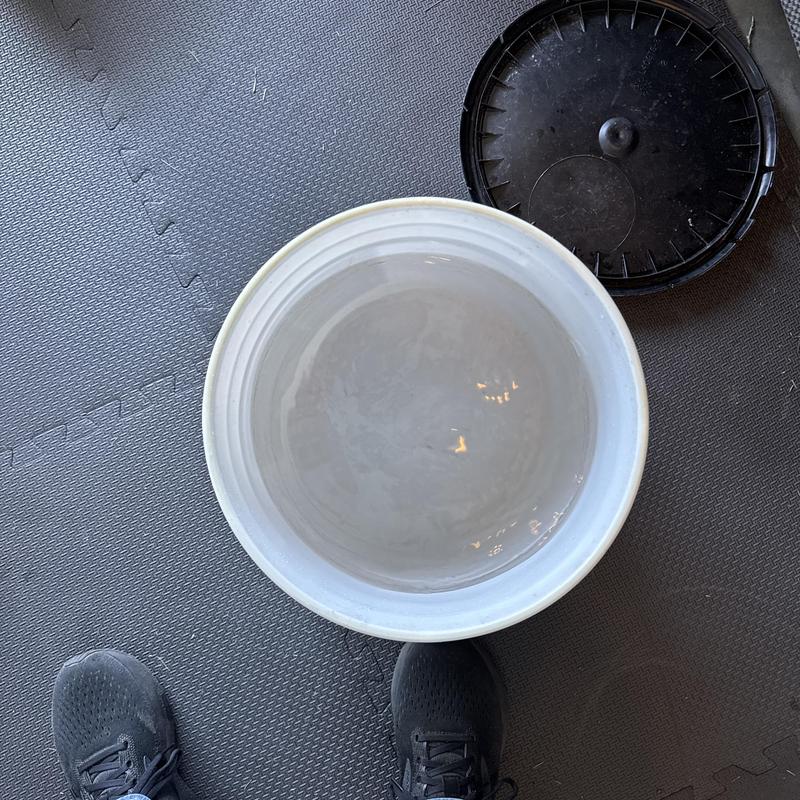 Tankless water heater descaling flush residue in bucket Tankless water heater descaling flush residue in bucket