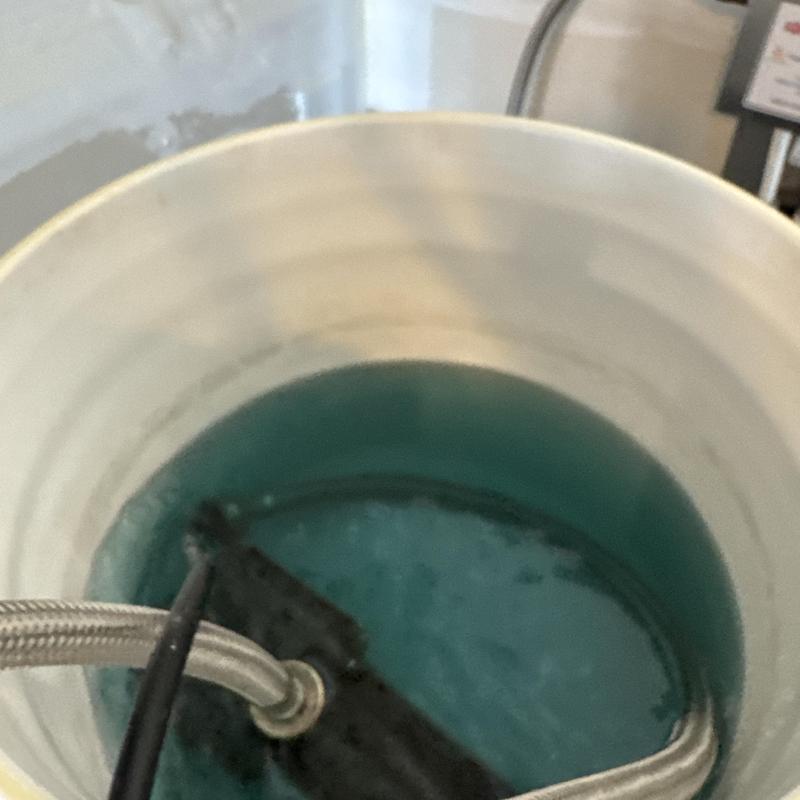 Rheeme tankless water heater descaling flush in bucket Rheeme tankless water heater descaling flush in bucket