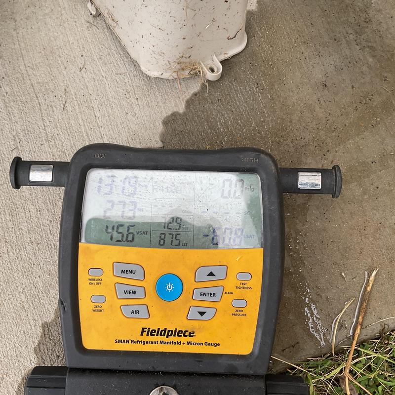 Refrigerant manifold gauge on air conditioning unit Refrigerant manifold gauge on air conditioning unit