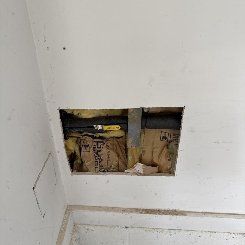Gas pipe with valve behind drywall opening Gas pipe with valve behind drywall opening