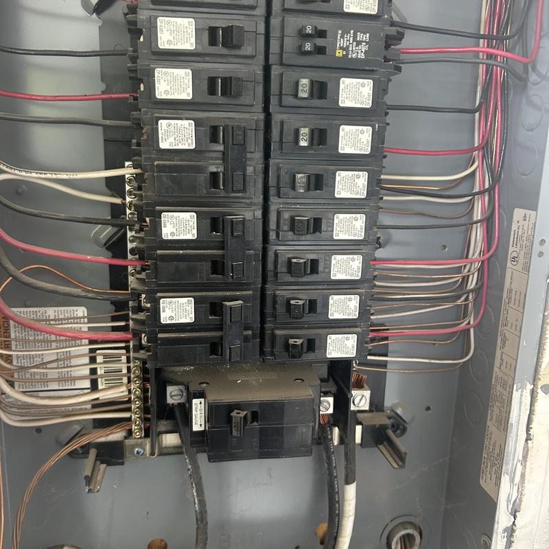 Electrical breaker panel with multiple circuit breakers and wiring Electrical breaker panel with multiple circuit breakers and wiring