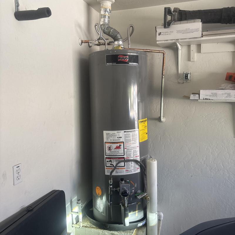 Water heater system with connected gas and vent pipes