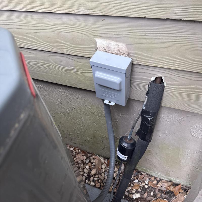 Disconnect box on air conditioner outdoor unit