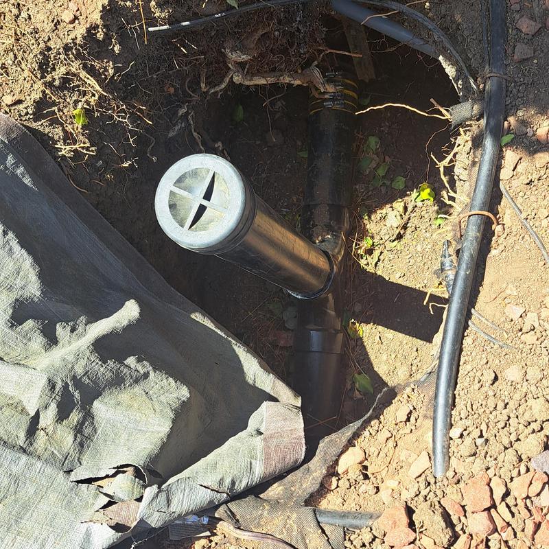 Clay lateral pipe with vent and surrounding soil excavation