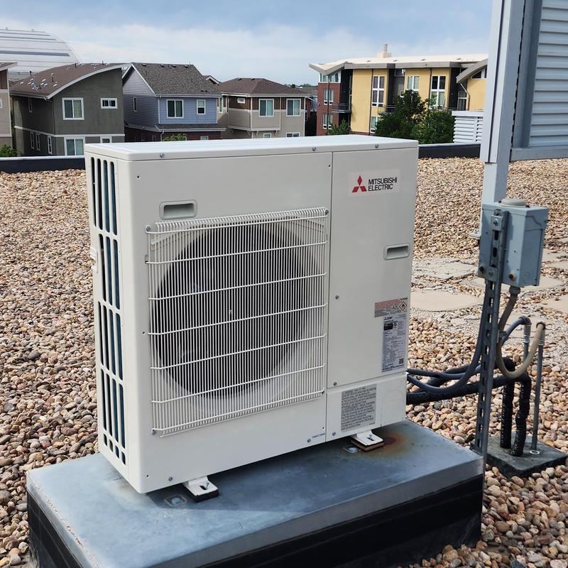 Mitsubishi mini split outdoor unit on rooftop Mitsubishi mini split outdoor unit on rooftop