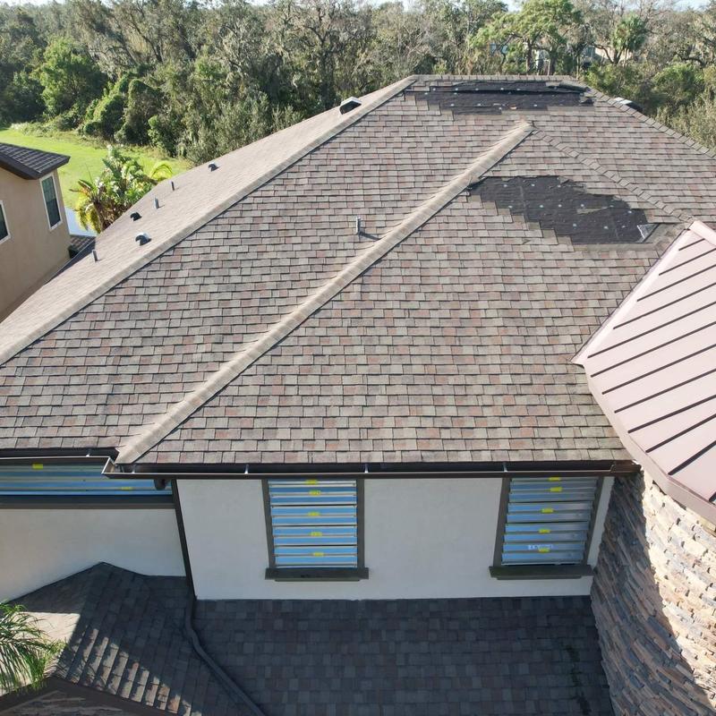 Asphalt shingle roof with storm damage and repairs Asphalt shingle roof with storm damage and repairs