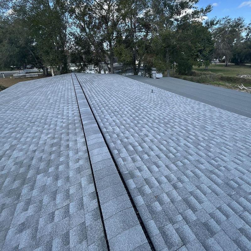 Architectural shingle roof with ridge vent installation Architectural shingle roof with ridge vent installation