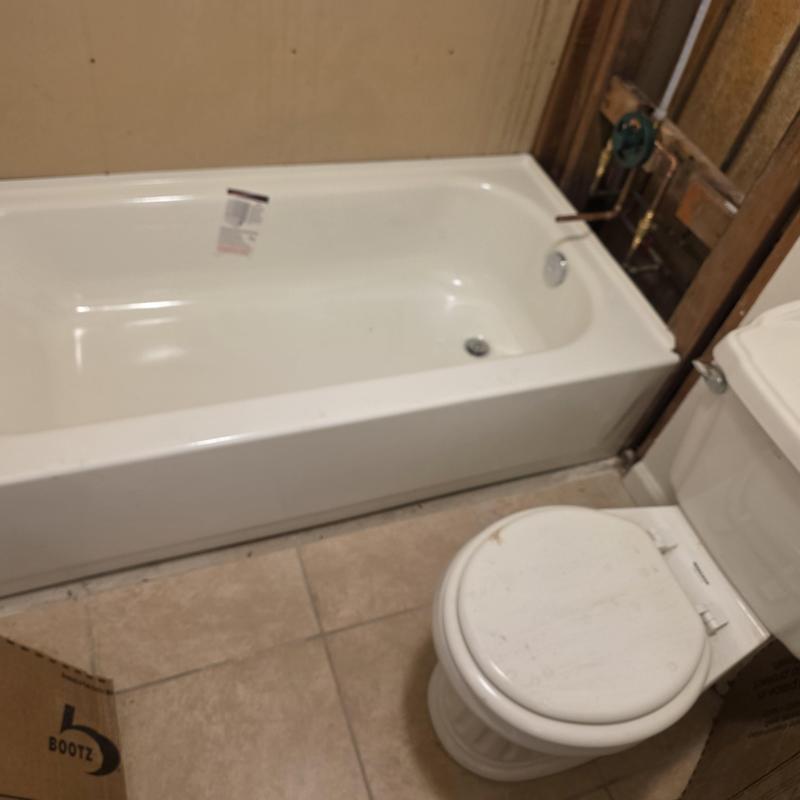 Bathtub and valve installation in bathroom remodel
