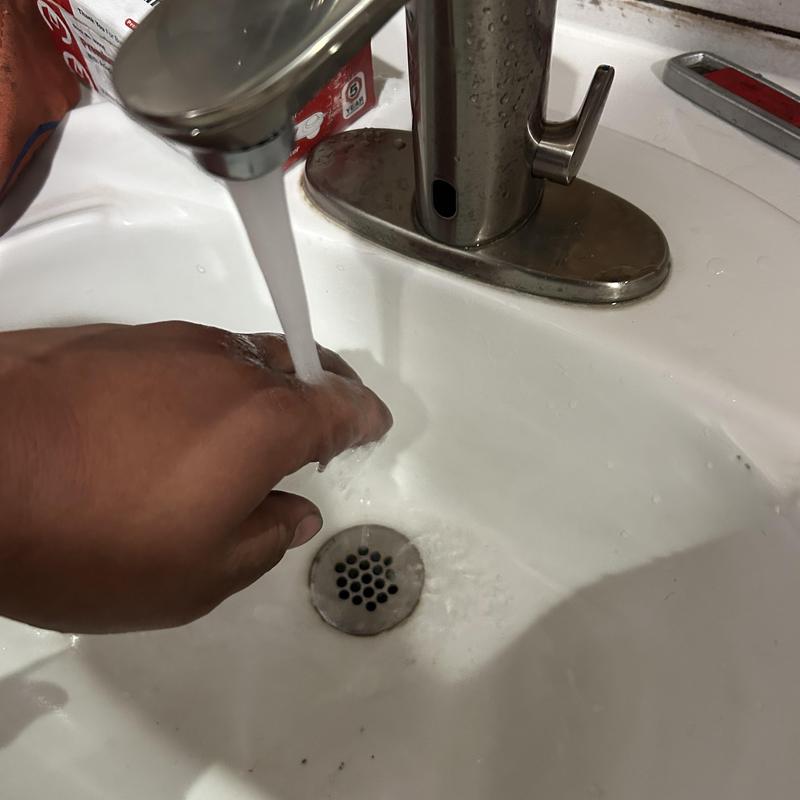 Commercial faucet flow test in sink basin Commercial faucet flow test in sink basin