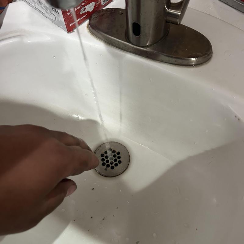 Commercial faucet water flow test in sink basin Commercial faucet water flow test in sink basin