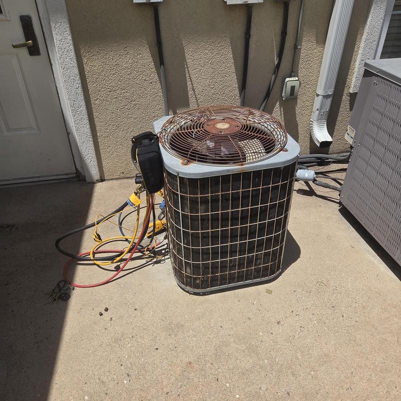 Air conditioner condenser unit with service gauges attached Air conditioner condenser unit with service gauges attached
